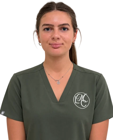 Woman wearing dark green medical scrubs portrait