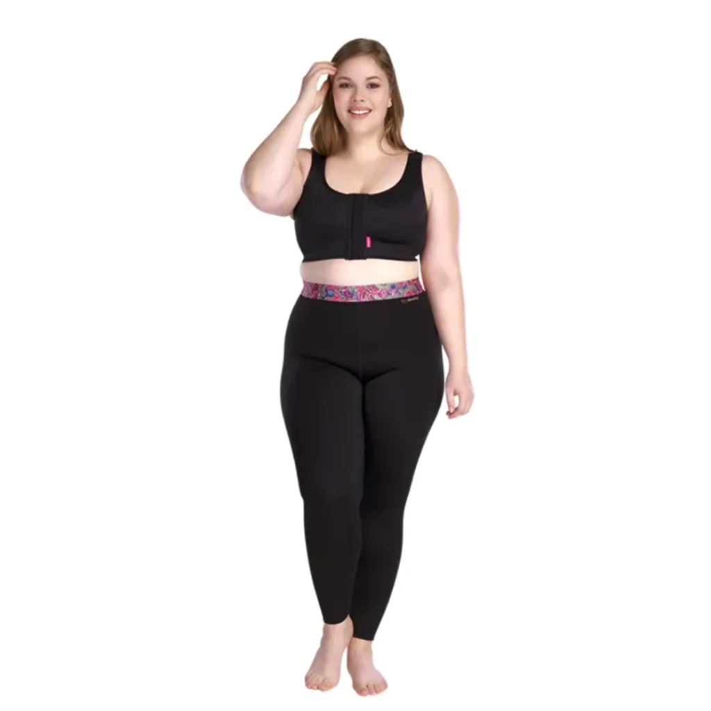 Woman wearing black activewear set with patterned waistband