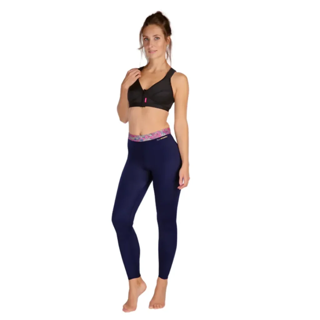 Woman modeling black sports bra and navy leggings